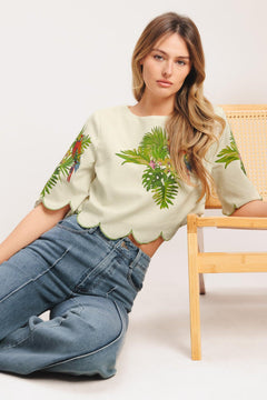 A printed woven crop top featuring round neckline, short sleeve, scallop edge and back neck button closure. Matching skirt IK7753T

Details:

Self: 50% Cotton 20% Rayon 20% Polyester 10% Linen

Lining: 100% Polyester

Size & Fit

-Model is 5`8" And Wearing Size Small
-Measurements Taken From Size Small
-Approx. Length: 17"