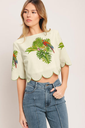 A printed woven crop top featuring round neckline, short sleeve, scallop edge and back neck button closure. Matching skirt IK7753T

Details:

Self: 50% Cotton 20% Rayon 20% Polyester 10% Linen

Lining: 100% Polyester

Size & Fit

-Model is 5`8" And Wearing Size Small
-Measurements Taken From Size Small
-Approx. Length: 17"