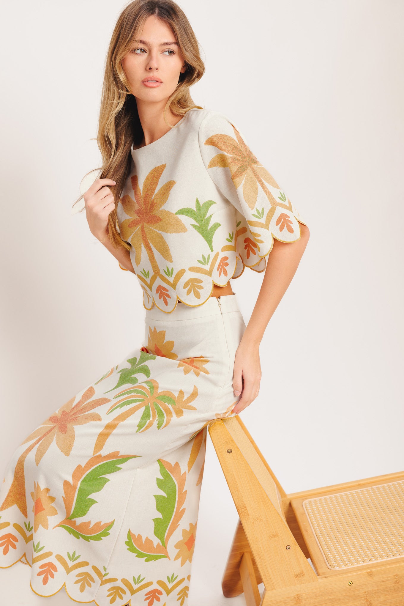 A printed woven crop top featuring round neckline, 3/4 sleeve with scalloped finish and back neck button closure

Details:

Self: 50% Cotton 20% Rayon 20% Polyester 10% Linen

Lining: 100% Polyester

Size & Fit

-Model is 5`8" And Wearing Size Small
-Measurements Taken From Size Small
-Approx. Length: 18"