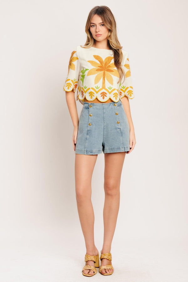 A printed woven crop top featuring round neckline, 3/4 sleeve with scalloped finish and back neck button closure

Details:

Self: 50% Cotton 20% Rayon 20% Polyester 10% Linen

Lining: 100% Polyester

Size & Fit

-Model is 5`8" And Wearing Size Small
-Measurements Taken From Size Small
-Approx. Length: 18"
