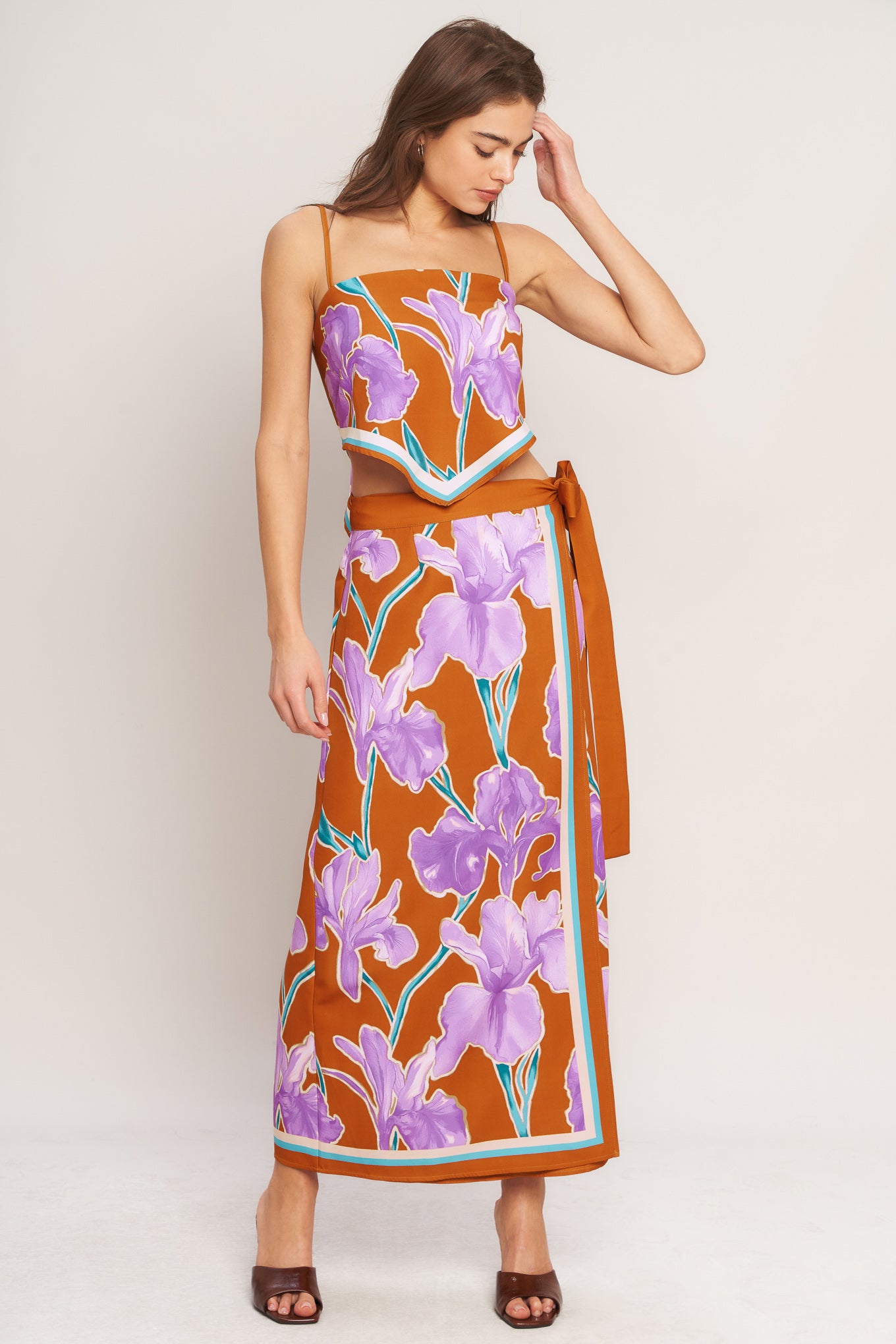 A printed scarf top with straight neckline, straps and back tie closure with matching skirt