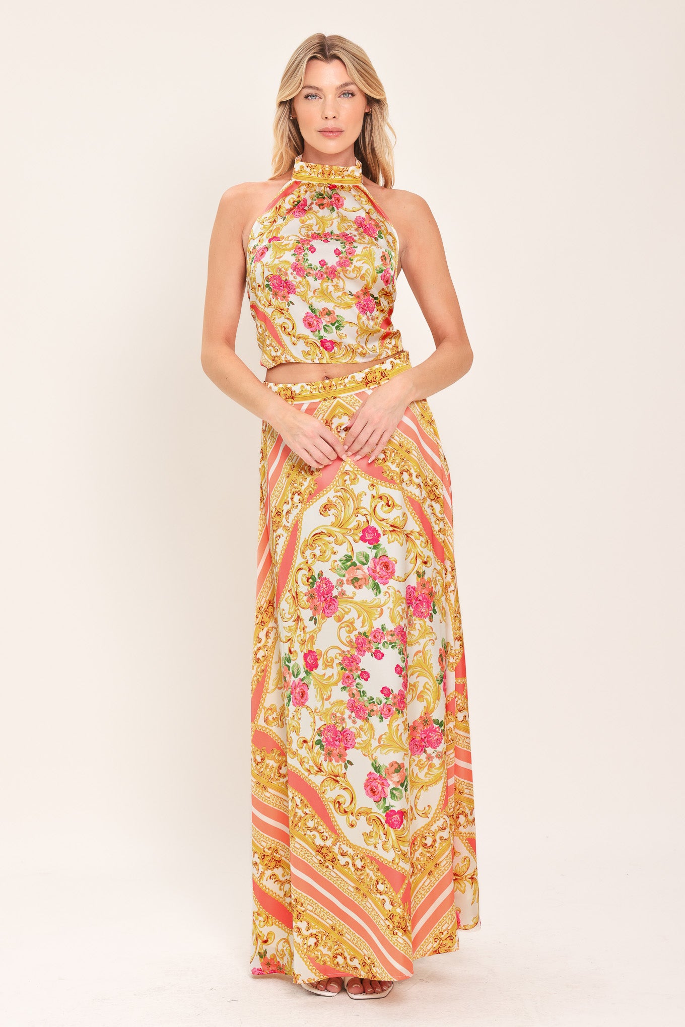 Woman wearing a floral and gold baroque patterned crop top | Flying Tomato