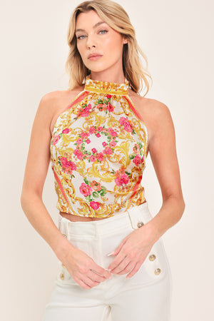 Woman wearing a floral and gold baroque patterned crop top | Flying Tomato