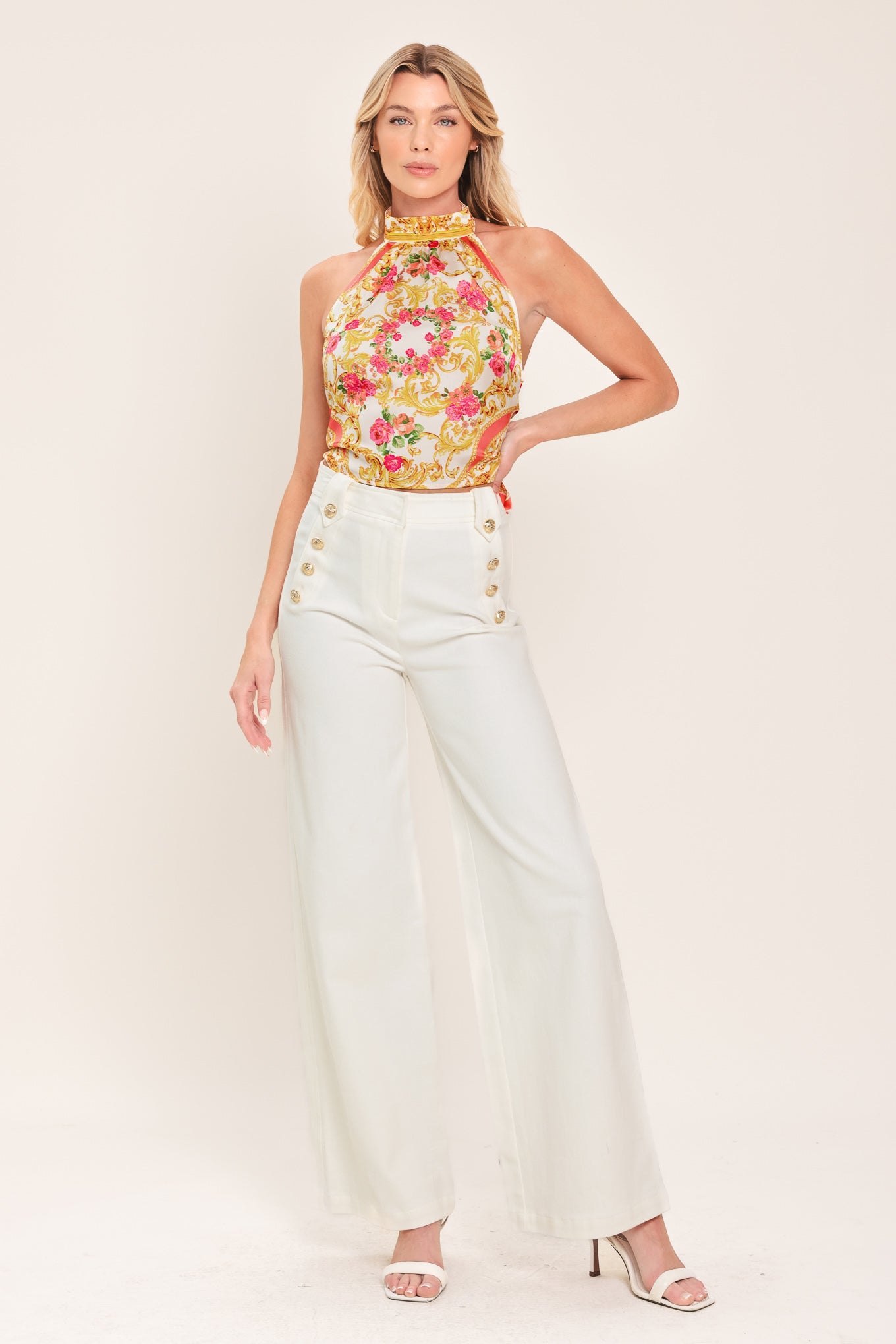 Woman wearing a floral and gold baroque patterned crop top | Flying Tomato