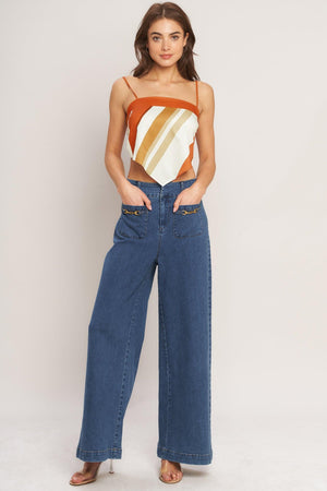 A printed woven scarf top featuring straight neckline, straps and tie back. 