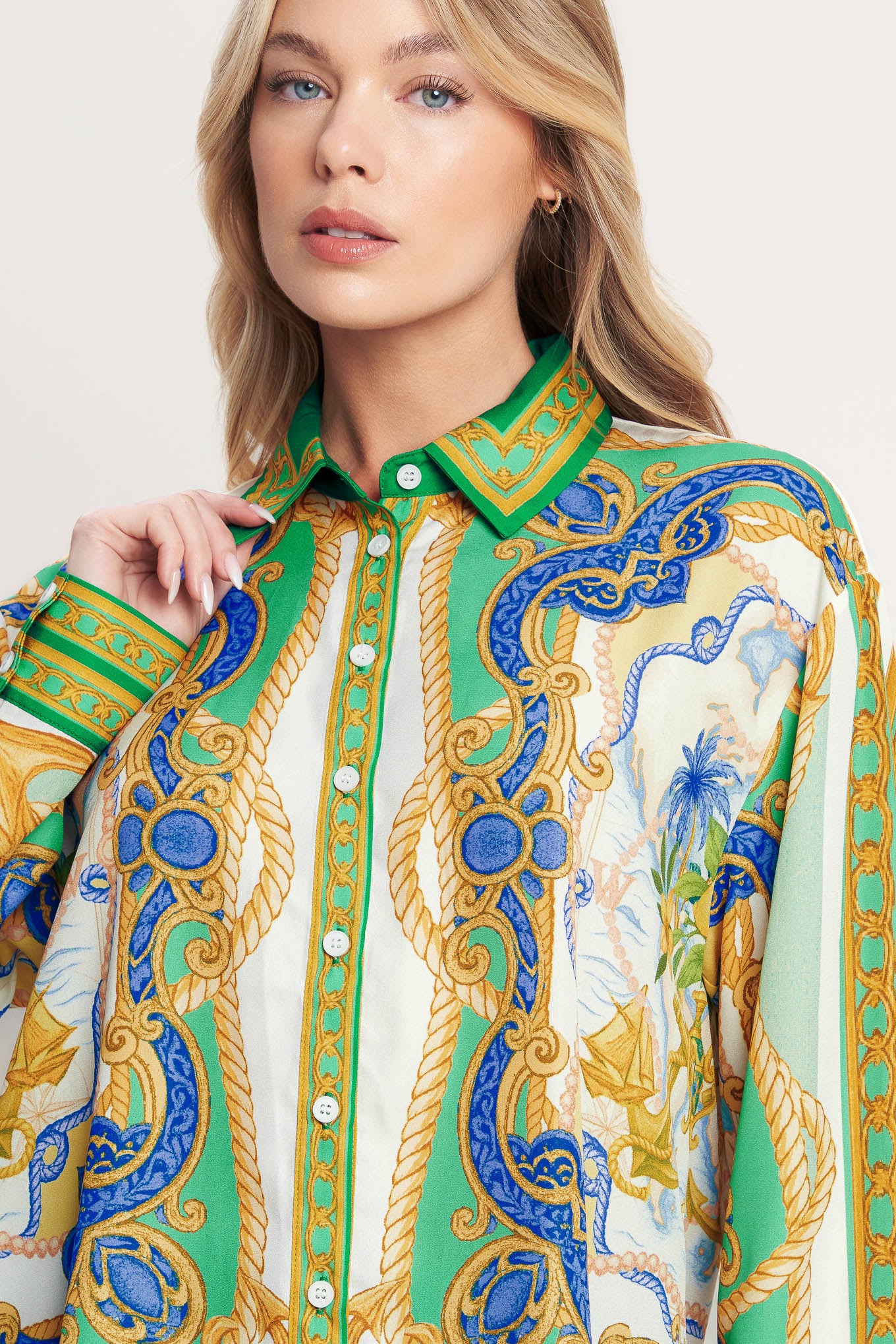 
A printed woven button down top with long sleeve. Matching skort IP9107T

Details:

Self : 100% Polyester

Size &amp; Fit

- Model is 5`8" And Wearing Size Small
- Measurements Taken From Size Small
- Approx. Length: 26"