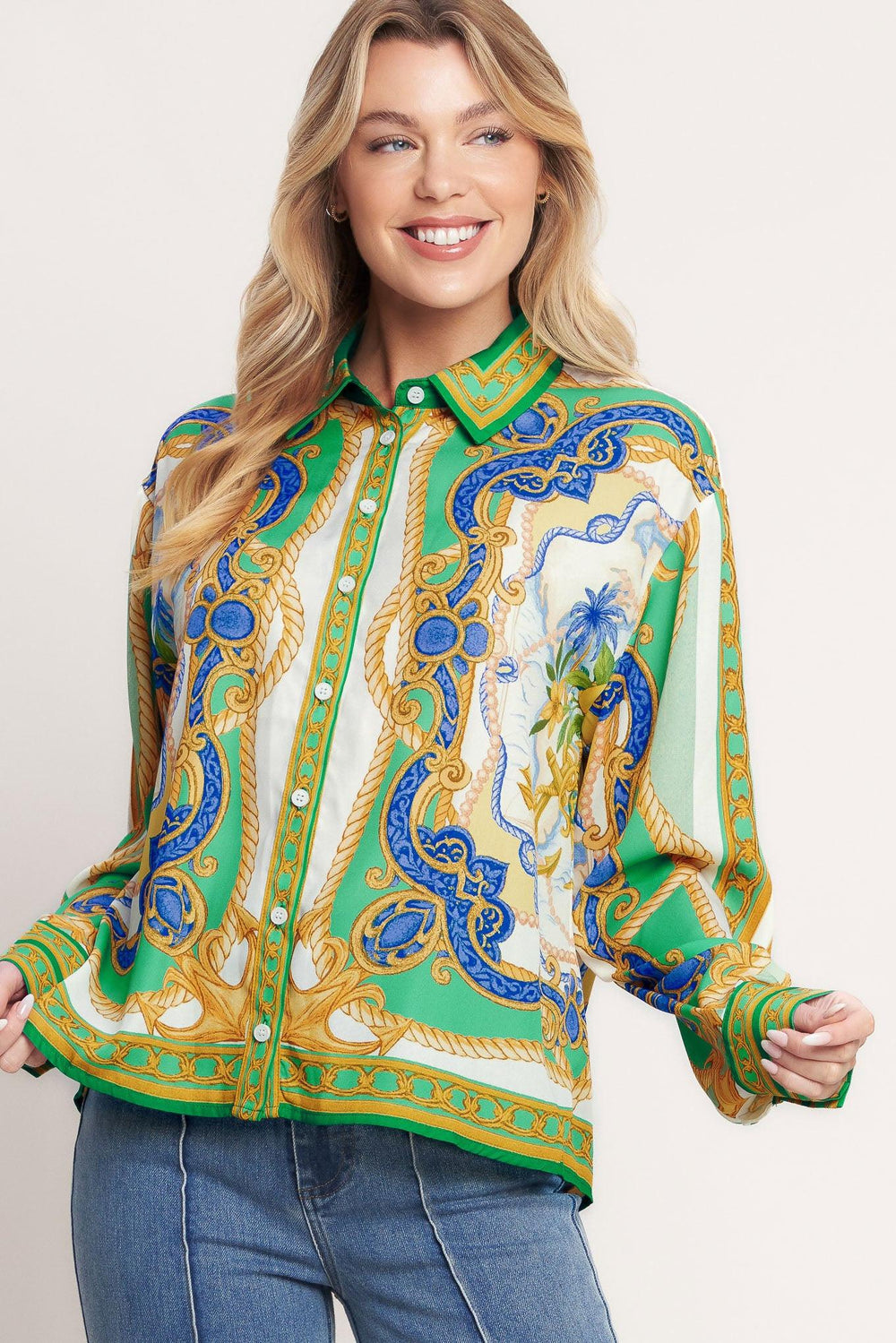 
A printed woven button down top with long sleeve. Matching skort IP9107T

Details:

Self : 100% Polyester

Size &amp; Fit

- Model is 5`8" And Wearing Size Small
- Measurements Taken From Size Small
- Approx. Length: 26"