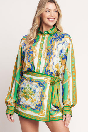 
A printed woven button down top with long sleeve. Matching skort IP9107T

Details:

Self : 100% Polyester

Size &amp; Fit

- Model is 5`8" And Wearing Size Small
- Measurements Taken From Size Small
- Approx. Length: 26"