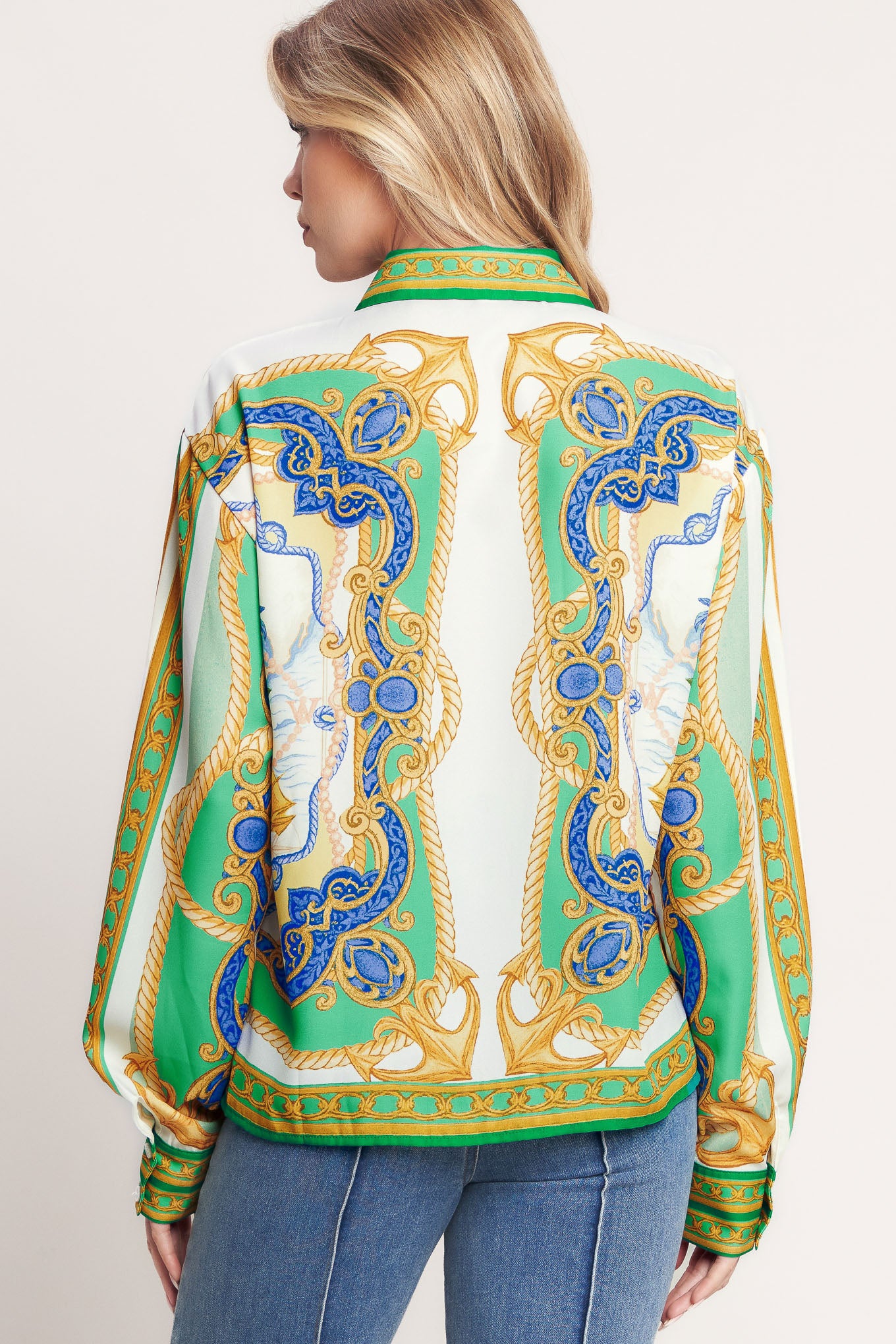 
A printed woven button down top with long sleeve. Matching skort IP9107T

Details:

Self : 100% Polyester

Size &amp; Fit

- Model is 5`8" And Wearing Size Small
- Measurements Taken From Size Small
- Approx. Length: 26"