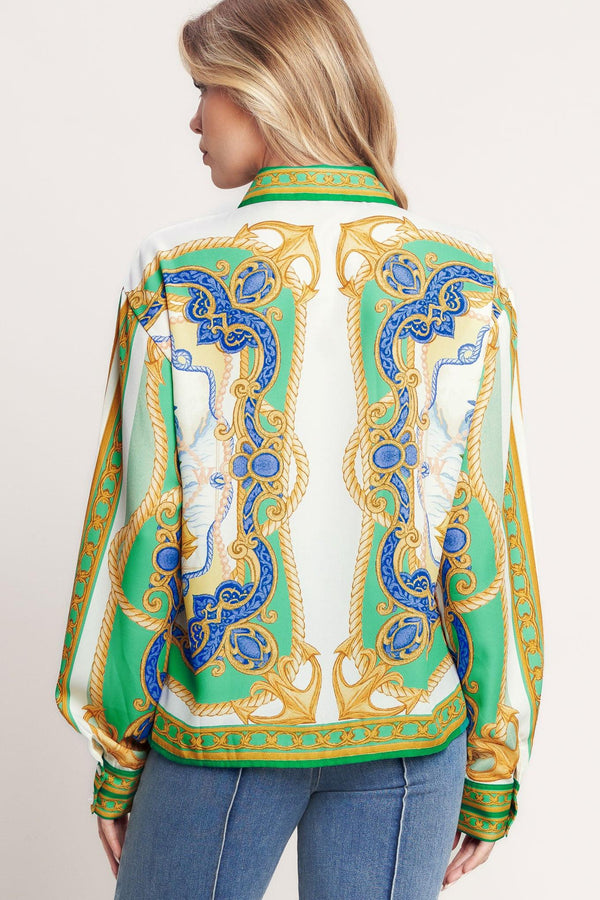
A printed woven button down top with long sleeve. Matching skort IP9107T

Details:

Self : 100% Polyester

Size &amp; Fit

- Model is 5`8" And Wearing Size Small
- Measurements Taken From Size Small
- Approx. Length: 26"