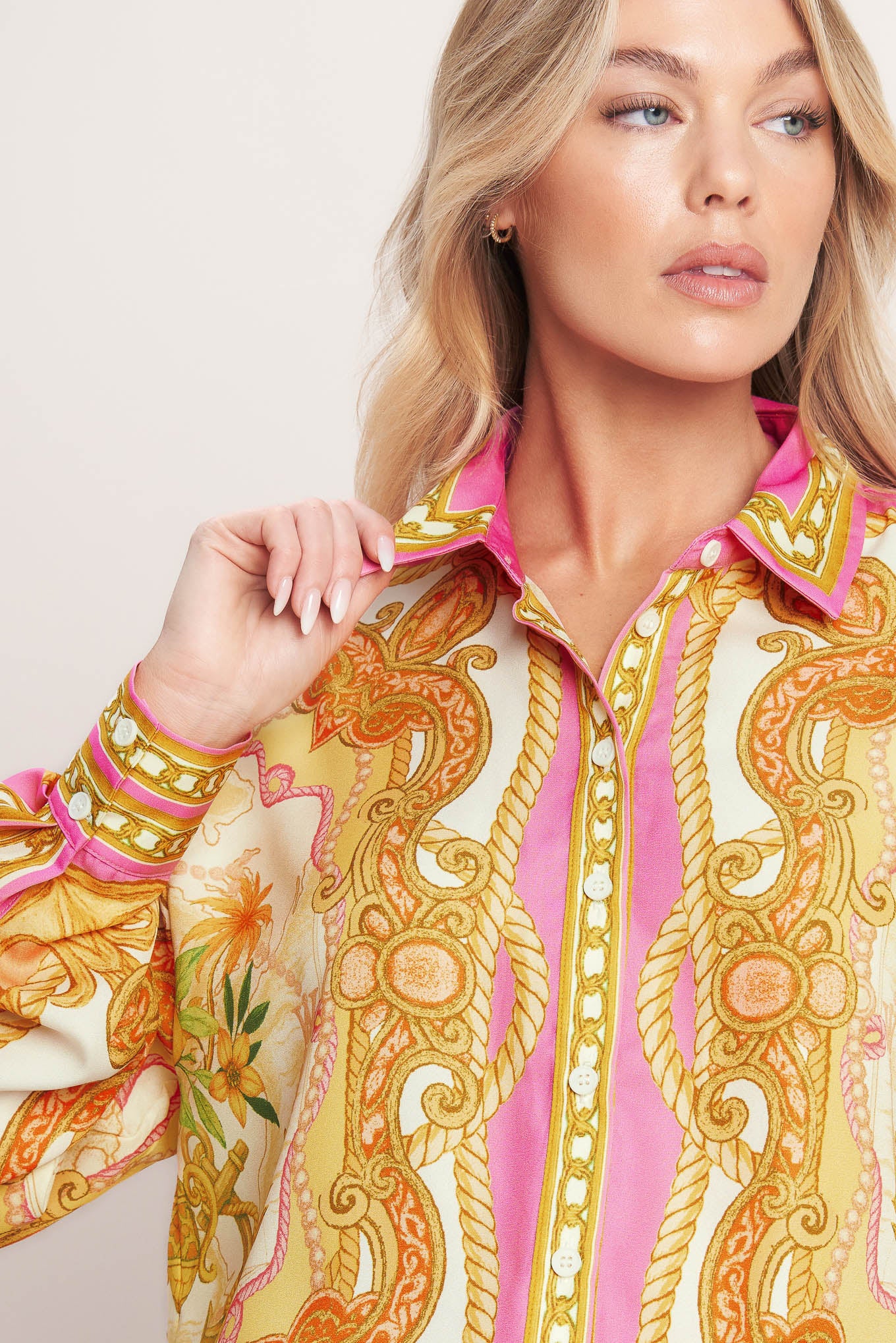 
A printed woven button down top with long sleeve. Matching skort IP9107T

Details:

Self : 100% Polyester

Size &amp; Fit

- Model is 5`8" And Wearing Size Small
- Measurements Taken From Size Small
- Approx. Length: 26"