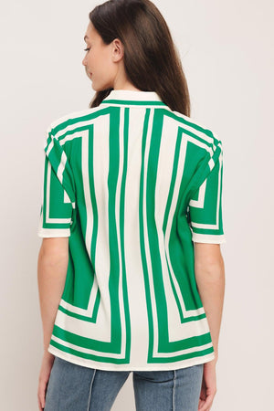 A printed woven top featuring collar, short sleeve and button down. Matching short IP9108T

Details:

Self: 100% Polyester

Size & Fit

-Model is 5`8" And Wearing Size Small
-Measurements Taken From Size Small
-Approx. Length: 26"