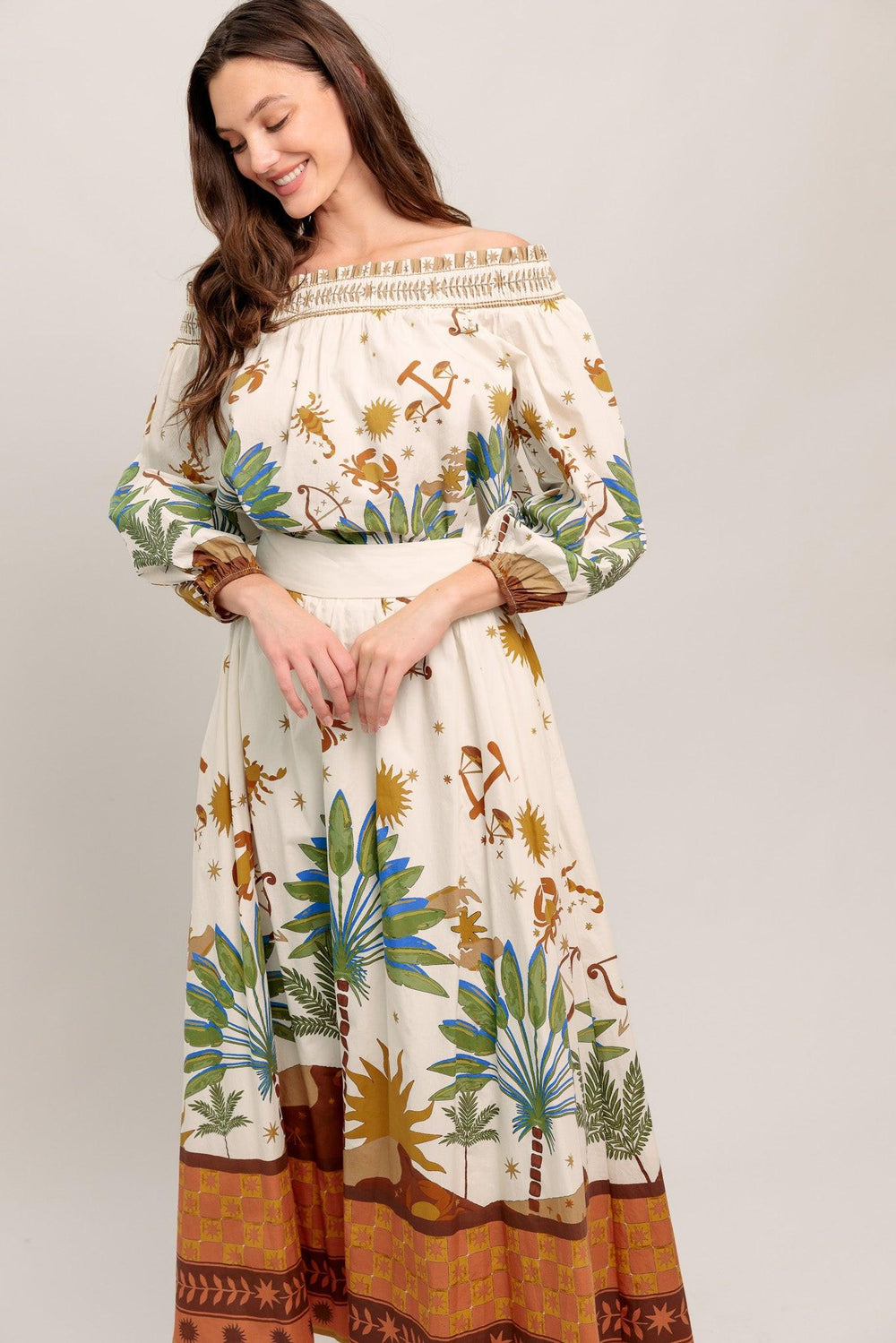 Off-the-shoulder boho blouse with a whimsical zodiac-inspired print and billowy sleeves

Details:

Self : 100% Cotton

Size & Fit

- Model is 5`8" And Wearing Size Small
- Measurements Taken From Size Small
- Approx. Length: 20"