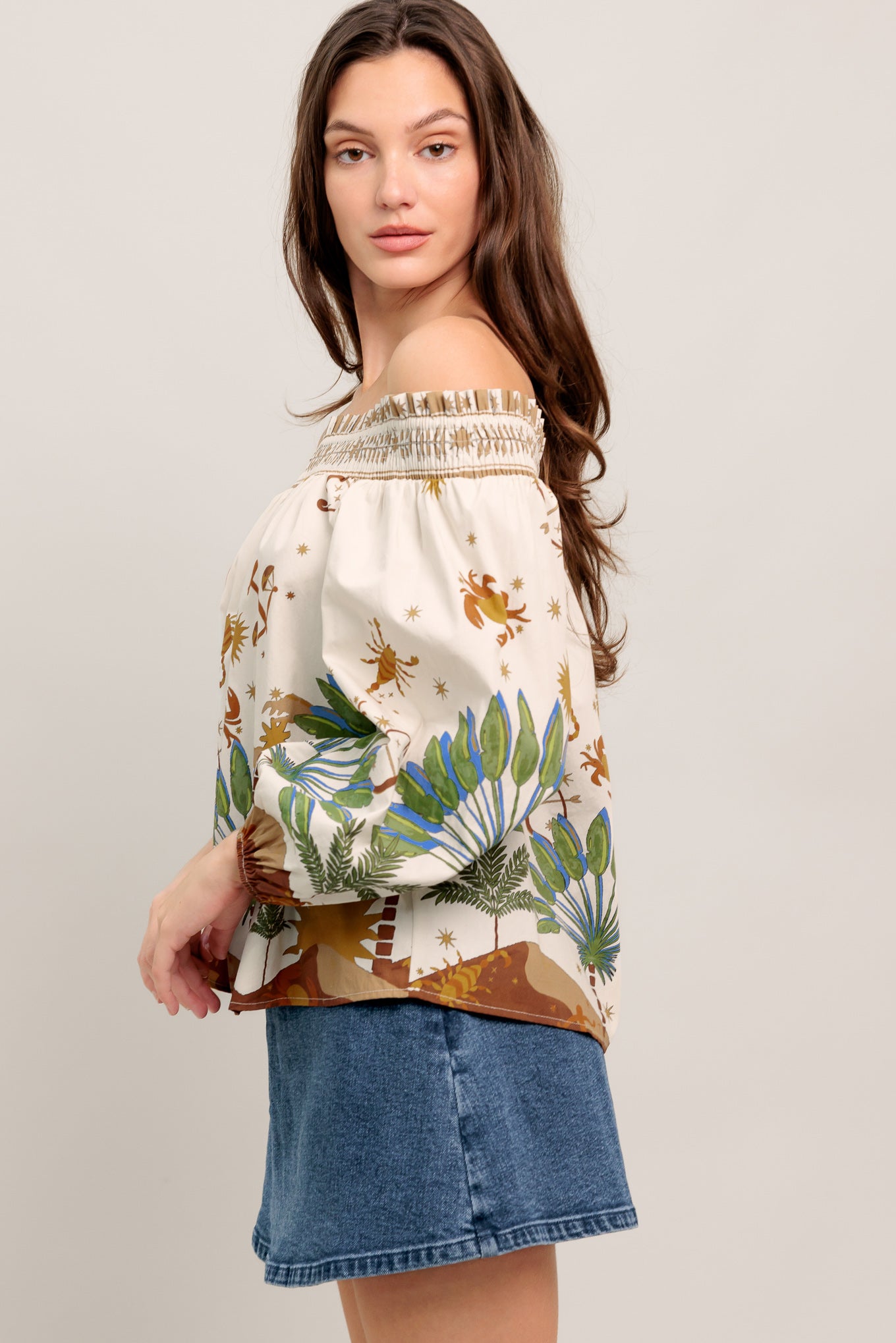 Off-the-shoulder boho blouse with a whimsical zodiac-inspired print and billowy sleeves

Details:

Self : 100% Cotton

Size & Fit

- Model is 5`8" And Wearing Size Small
- Measurements Taken From Size Small
- Approx. Length: 20"