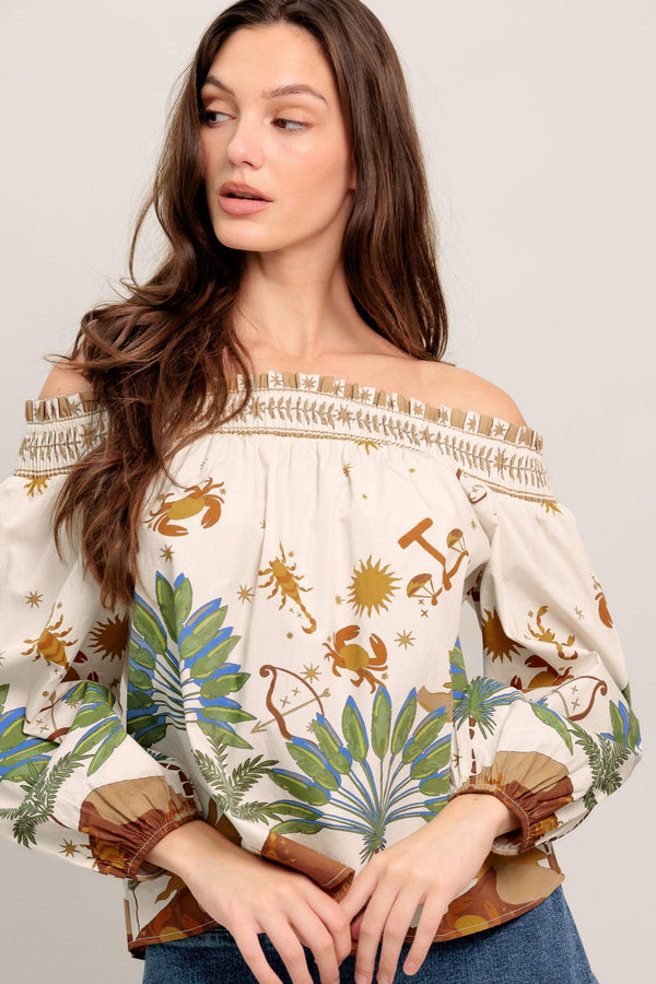 Off-the-shoulder boho blouse with a whimsical zodiac-inspired print and billowy sleeves

Details:

Self : 100% Cotton

Size & Fit

- Model is 5`8" And Wearing Size Small
- Measurements Taken From Size Small
- Approx. Length: 20"