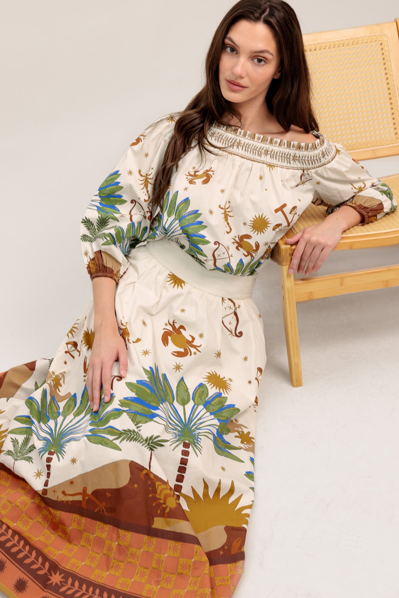 Off-the-shoulder boho blouse with a whimsical zodiac-inspired print and billowy sleeves

Details:

Self : 100% Cotton

Size & Fit

- Model is 5`8" And Wearing Size Small
- Measurements Taken From Size Small
- Approx. Length: 20"