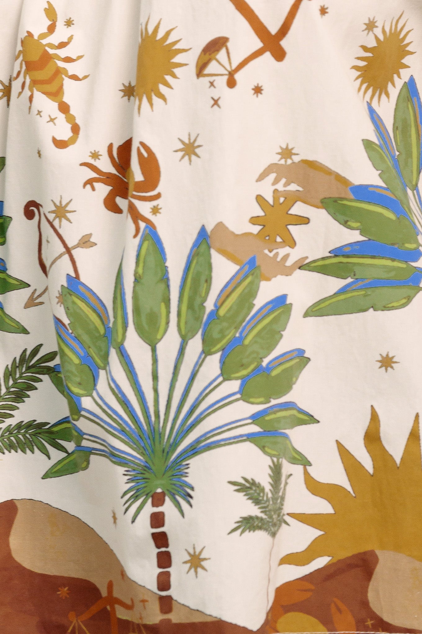 Off-the-shoulder boho blouse with a whimsical zodiac-inspired print and billowy sleeves

Details:

Self : 100% Cotton

Size & Fit

- Model is 5`8" And Wearing Size Small
- Measurements Taken From Size Small
- Approx. Length: 20"