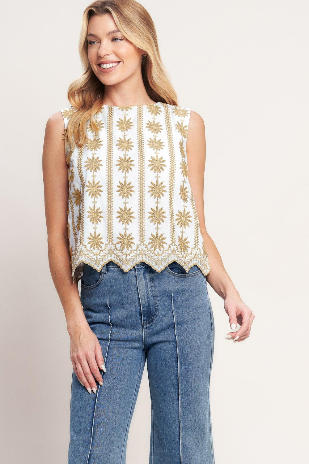 A woven embroidered top featuring round neckline, sleeveless and back neck button closure

Details:

Self: 100% Cotton

Lining: 100% Polyester

Size & Fit

-Model is 5`8" And Wearing Size Small
-Measurements Taken From Size Small
-Approx. Length: 21"