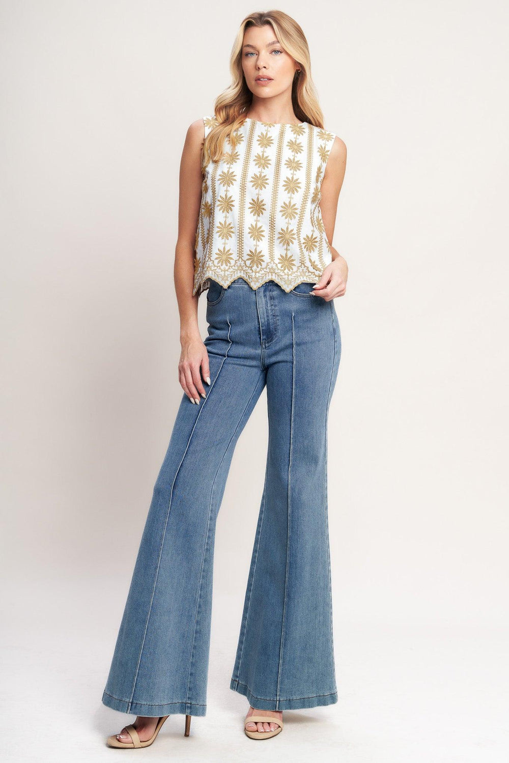 A woven embroidered top featuring round neckline, sleeveless and back neck button closure

Details:

Self: 100% Cotton

Lining: 100% Polyester

Size & Fit

-Model is 5`8" And Wearing Size Small
-Measurements Taken From Size Small
-Approx. Length: 21"