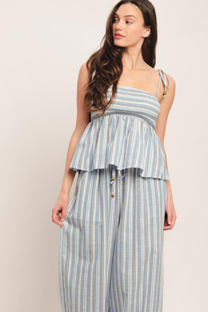 A striped woven top featuring straight neckline, shoulder tie and smocked bodice. Matching pant IP9116T

Details:

Self: 60% Polyester 20% Cotton 20% Linen

Size & Fit

-Model is 5`8" And Wearing Size Small
-Measurements Taken From Size Small
-Approx. Length: 21"