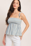 A striped woven top featuring straight neckline, shoulder tie and smocked bodice. Matching pant IP9116T

Details:

Self: 60% Polyester 20% Cotton 20% Linen

Size & Fit

-Model is 5`8" And Wearing Size Small
-Measurements Taken From Size Small
-Approx. Length: 21"