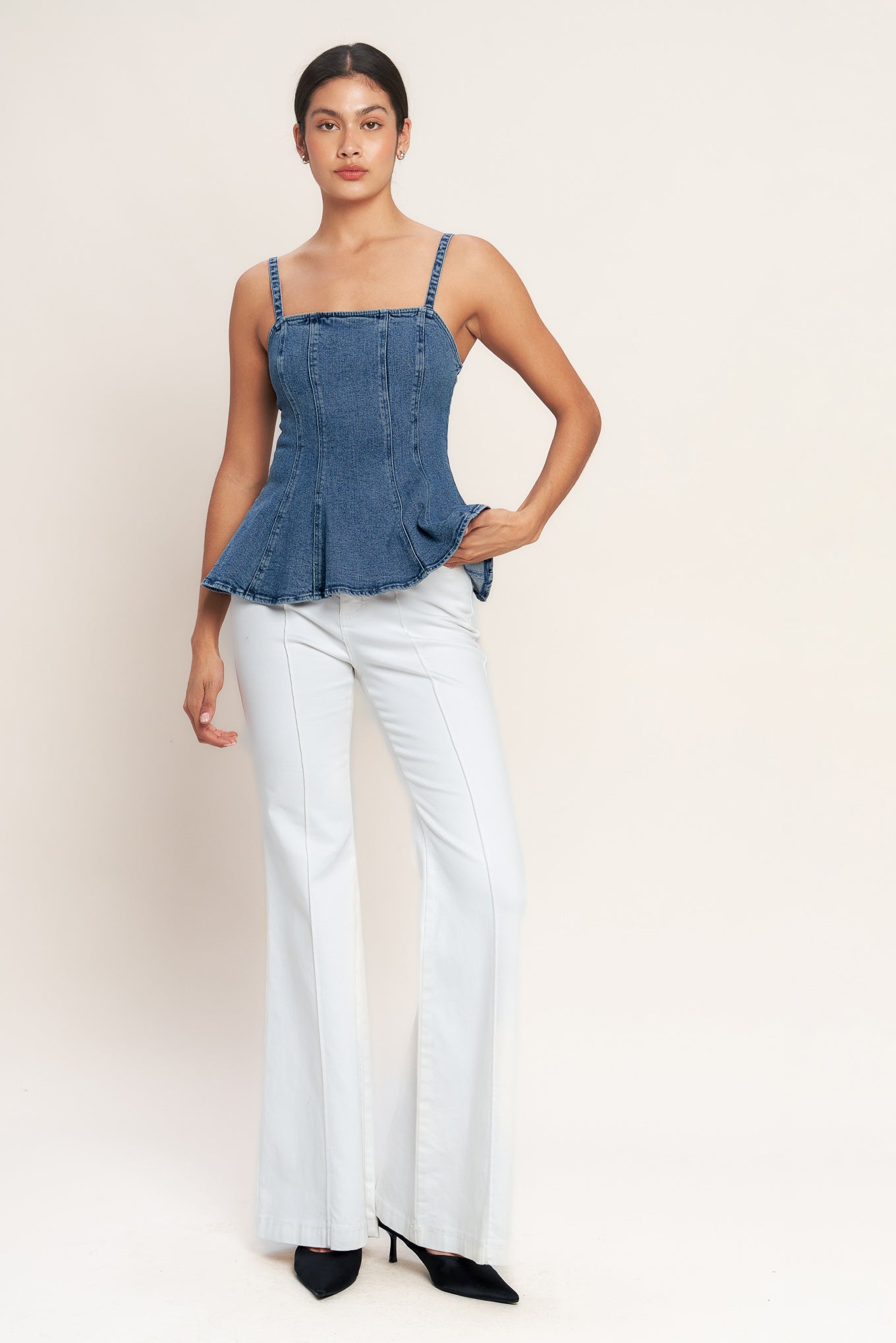 
A washed denim top featuring straight neckline, straps, peplum and back zipper closure

Details:

Self : 99% Cotton 1% Spandex

Size &amp; Fit

- Model is 5`8" And Wearing Size Small
- Measurements Taken From Size Small
- Approx. Length: 24" Flying Tomato