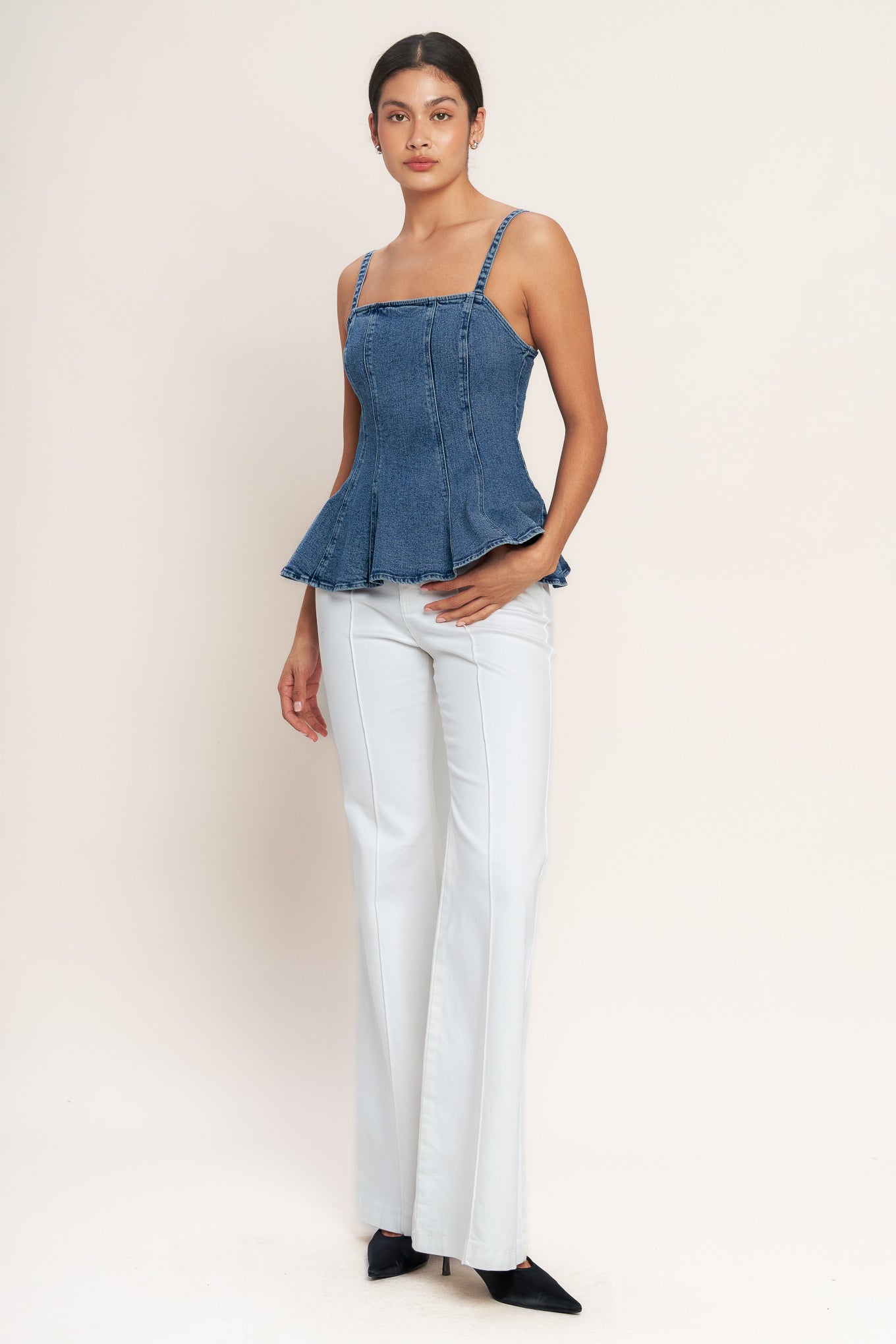 
A washed denim top featuring straight neckline, straps, peplum and back zipper closure

Details:

Self : 99% Cotton 1% Spandex

Size &amp; Fit

- Model is 5`8" And Wearing Size Small
- Measurements Taken From Size Small
- Approx. Length: 24" Flying Tomato