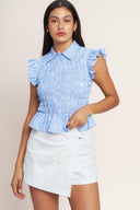 
A striped woven top featuring collar, ruffle sleeve, button down, smocked bodice and peplum

Details:

Self : 60% Cotton 40% Polyester

Size &amp; Fit

- Model is 5`8" And Wearing Size Small
- Measurements Taken From Size Small
- Approx. Length: 20" Flying Tomato