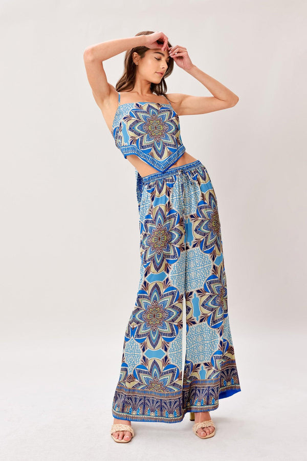 A printed woven scarf top and wide leg pant set