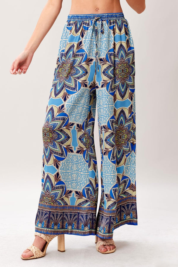 A printed woven scarf top and wide leg pant set