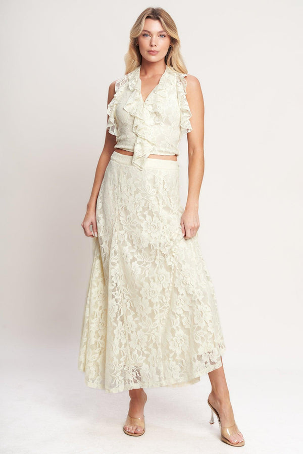 
A woven lace top featuring halter neckline, ruffles, tie back and smocked back bodice. Matching skirt IK7780T

Details:

Self : 90% Nylon 10% Spandex
Lining : 100% Polyester

Size &amp; Fit

- Model is 5`8" And Wearing Size Small
- Measurements Taken From Size Small
- Approx. Length: 18"