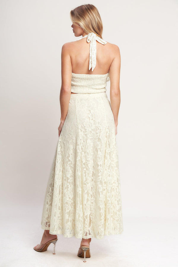 
A woven lace top featuring halter neckline, ruffles, tie back and smocked back bodice. Matching skirt IK7780T

Details:

Self : 90% Nylon 10% Spandex
Lining : 100% Polyester

Size &amp; Fit

- Model is 5`8" And Wearing Size Small
- Measurements Taken From Size Small
- Approx. Length: 18"
