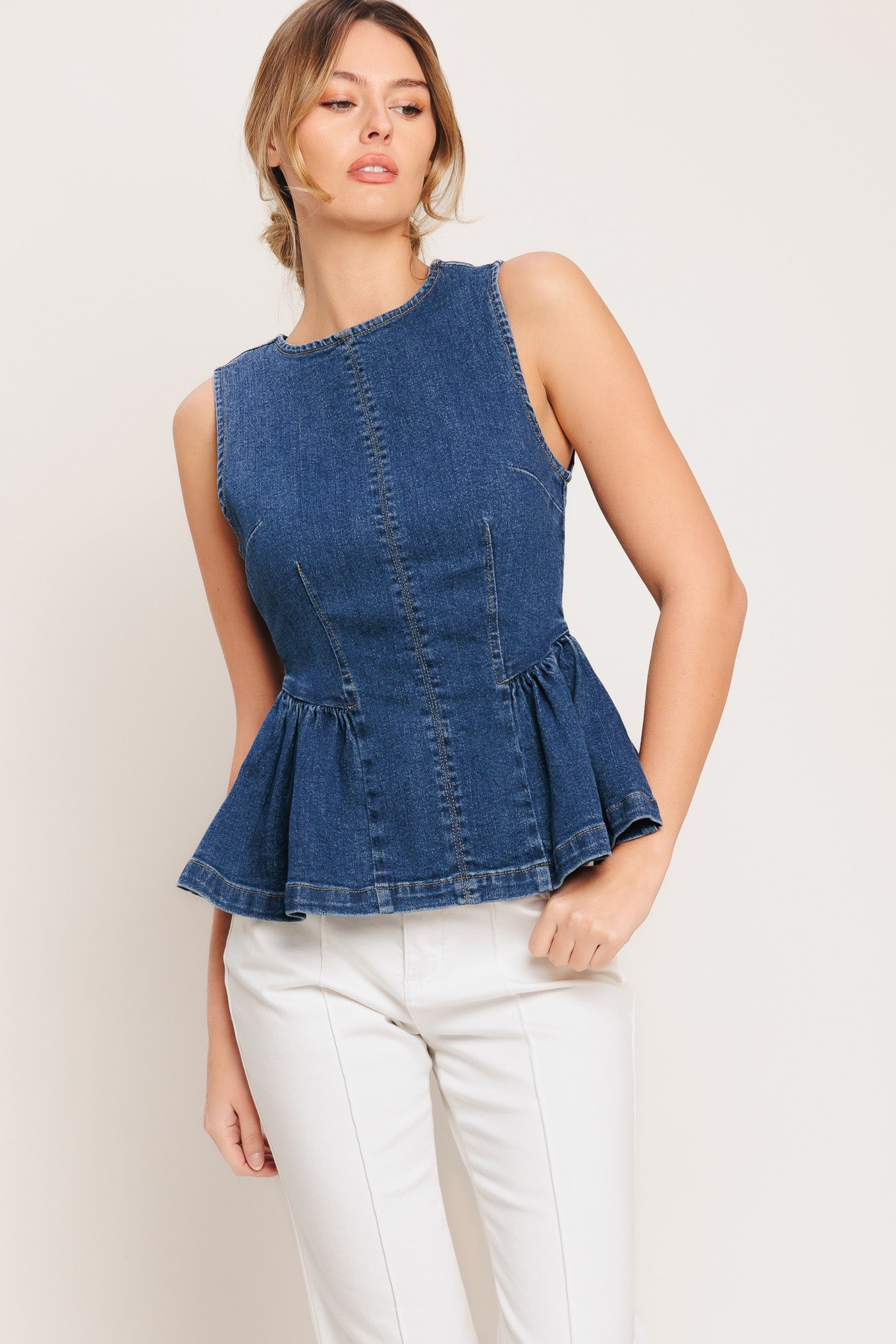 A washed denim top featuring round neckline, sleeveless, peplum and back zipper closure

Details:

Self: 85% Cotton 5% Polyester 8% Viscose 2% Spandex

Size & Fit

-Model is 5`8" And Wearing Size Small
-Measurements Taken From Size Small
-Approx. Length: 24"