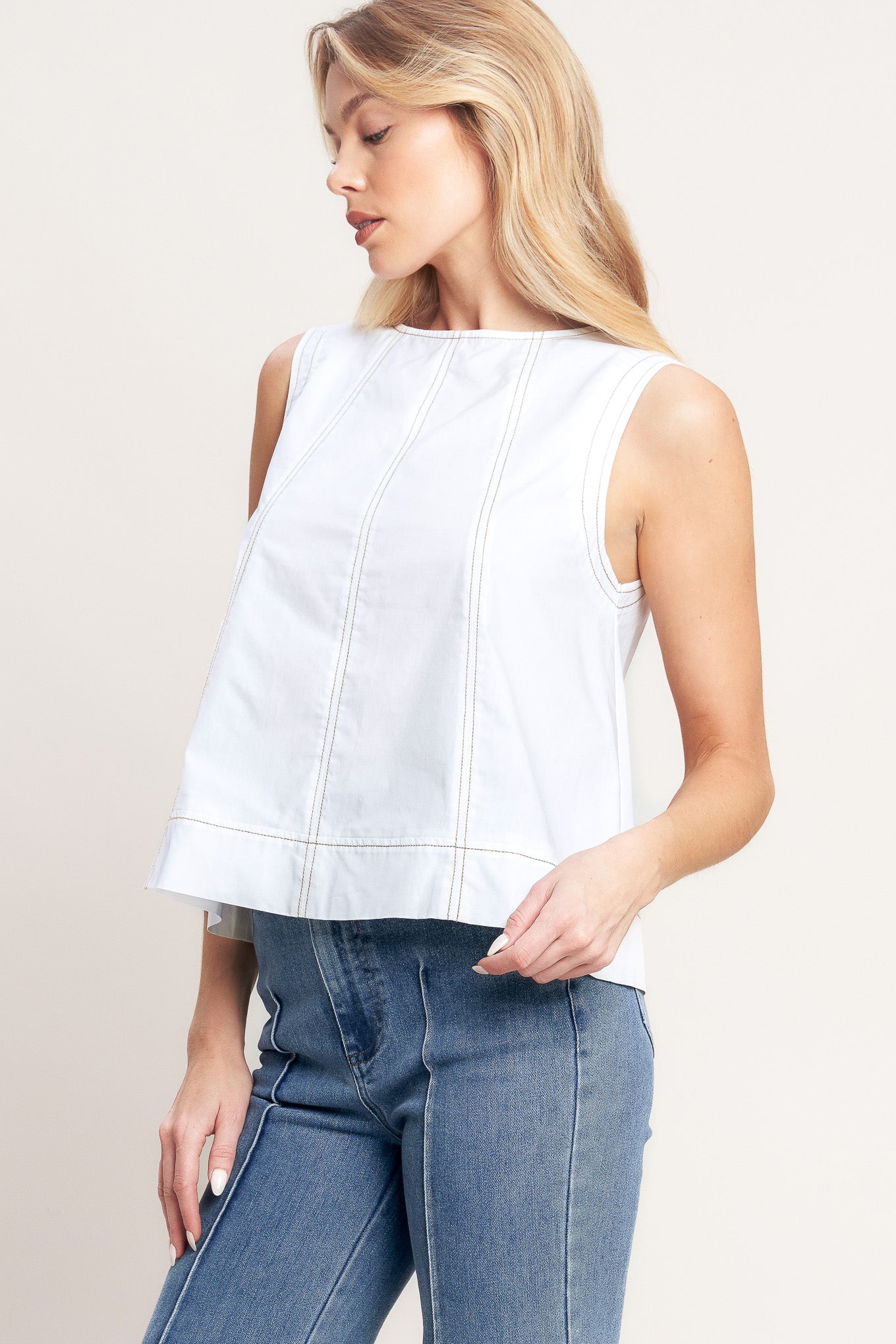 A solid woven top featuring round neckline, sleeveless and back neck tie closure

Details: Self : 100% Cotton

Size & Fit

-Model is 5`8" And Wearing Size Small
-Measurements Taken From Size Small
-Approx. Length: 21"