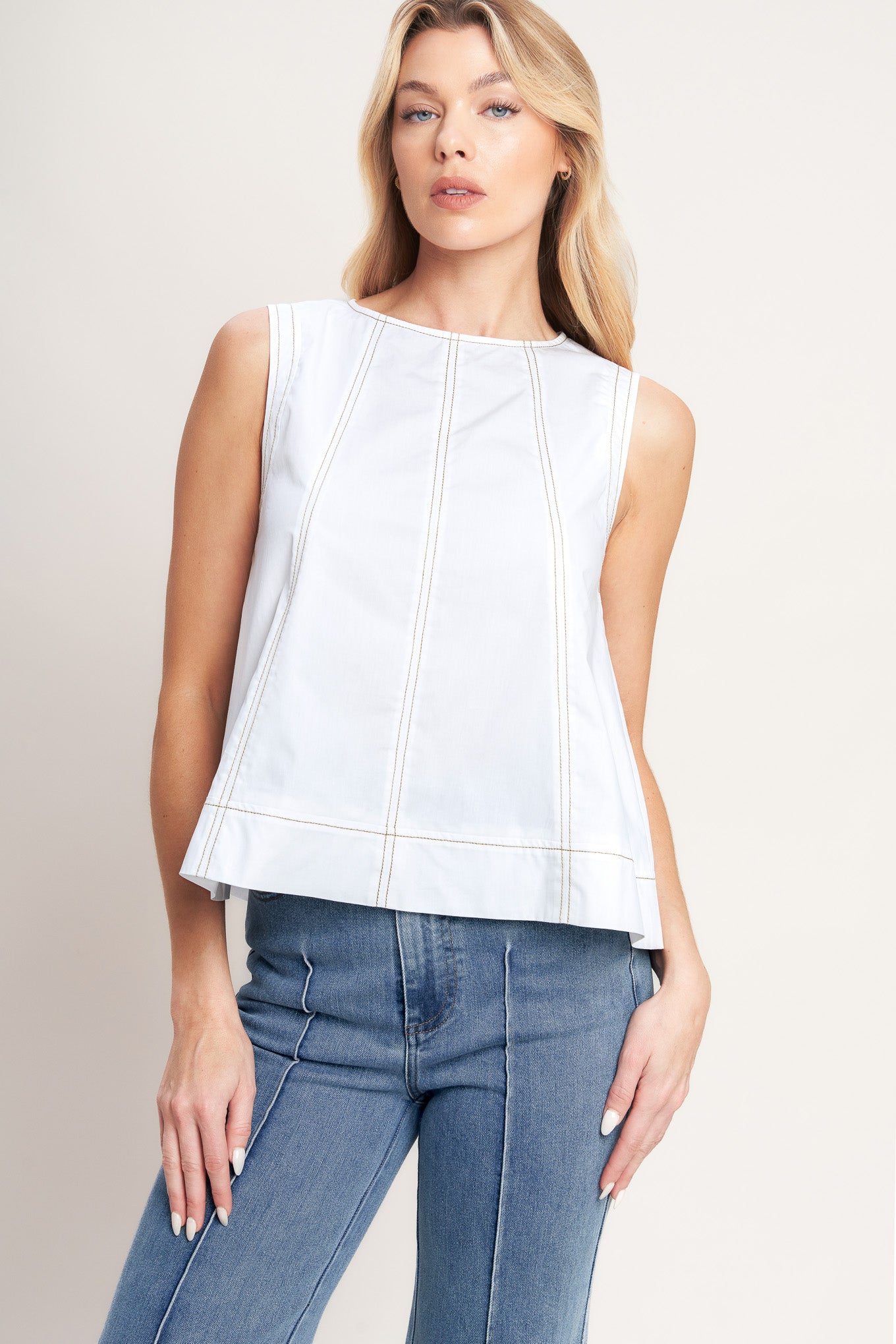 A solid woven top featuring round neckline, sleeveless and back neck tie closure

Details: Self : 100% Cotton

Size & Fit

-Model is 5`8" And Wearing Size Small
-Measurements Taken From Size Small
-Approx. Length: 21"