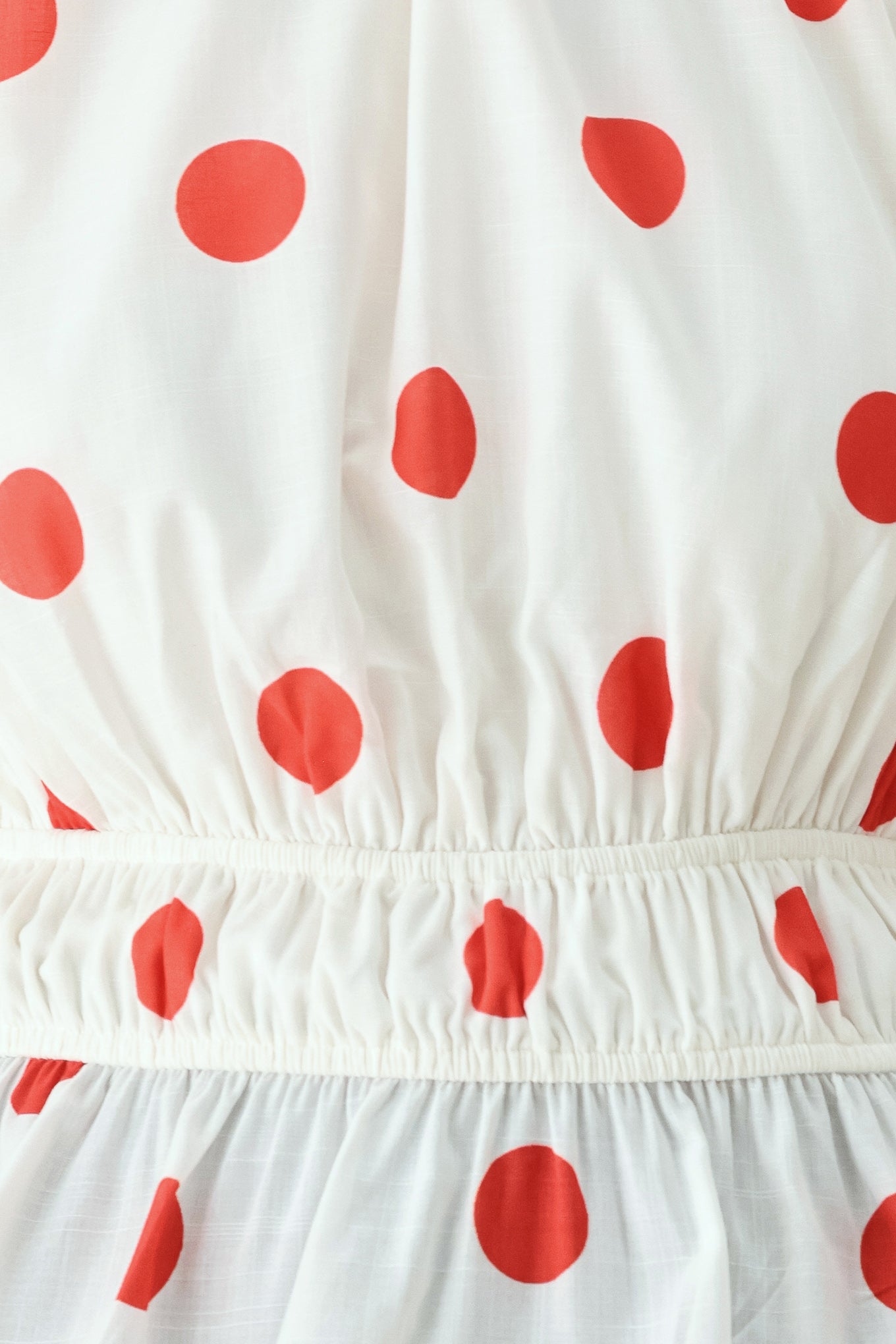 White fabric with red polka dots