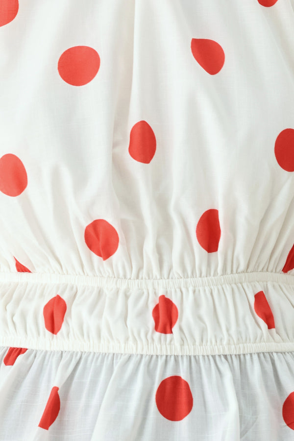 White fabric with red polka dots