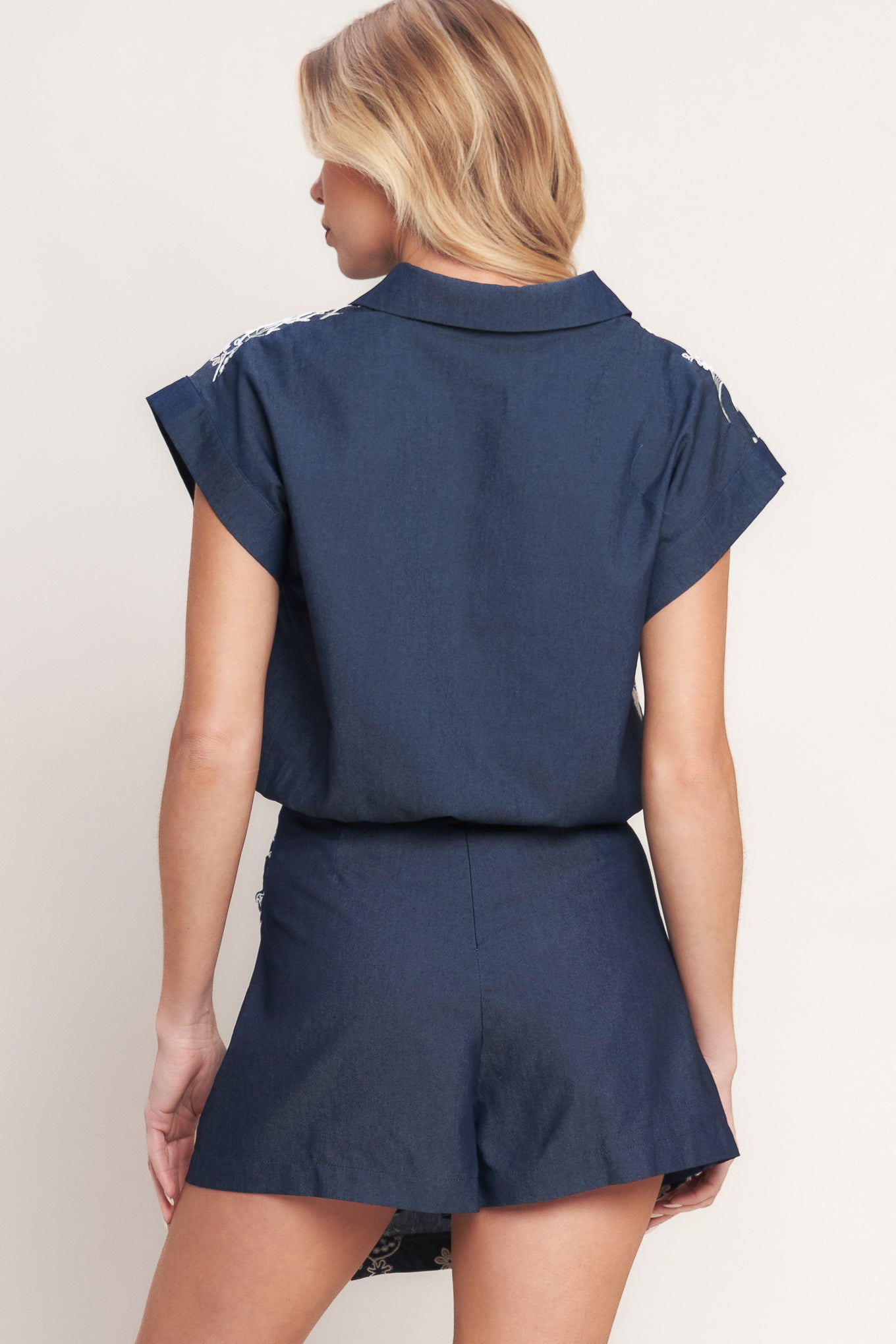 A solid and embroidery combination top featuring collar, V neck, short sleeve, front button down and elasticized waist. Matching skort IP9180T

Details:

Self: 100% Cotton

Contrast: 100% Cotton

Size & Fit

-Model is 5`8" And Wearing Size Small
-Measurements Taken From Size Small
-Approx. Length: 20"