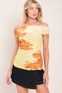 Woman wearing a yellow and orange floral off-shoulder power mesh top | Flying Tomato
