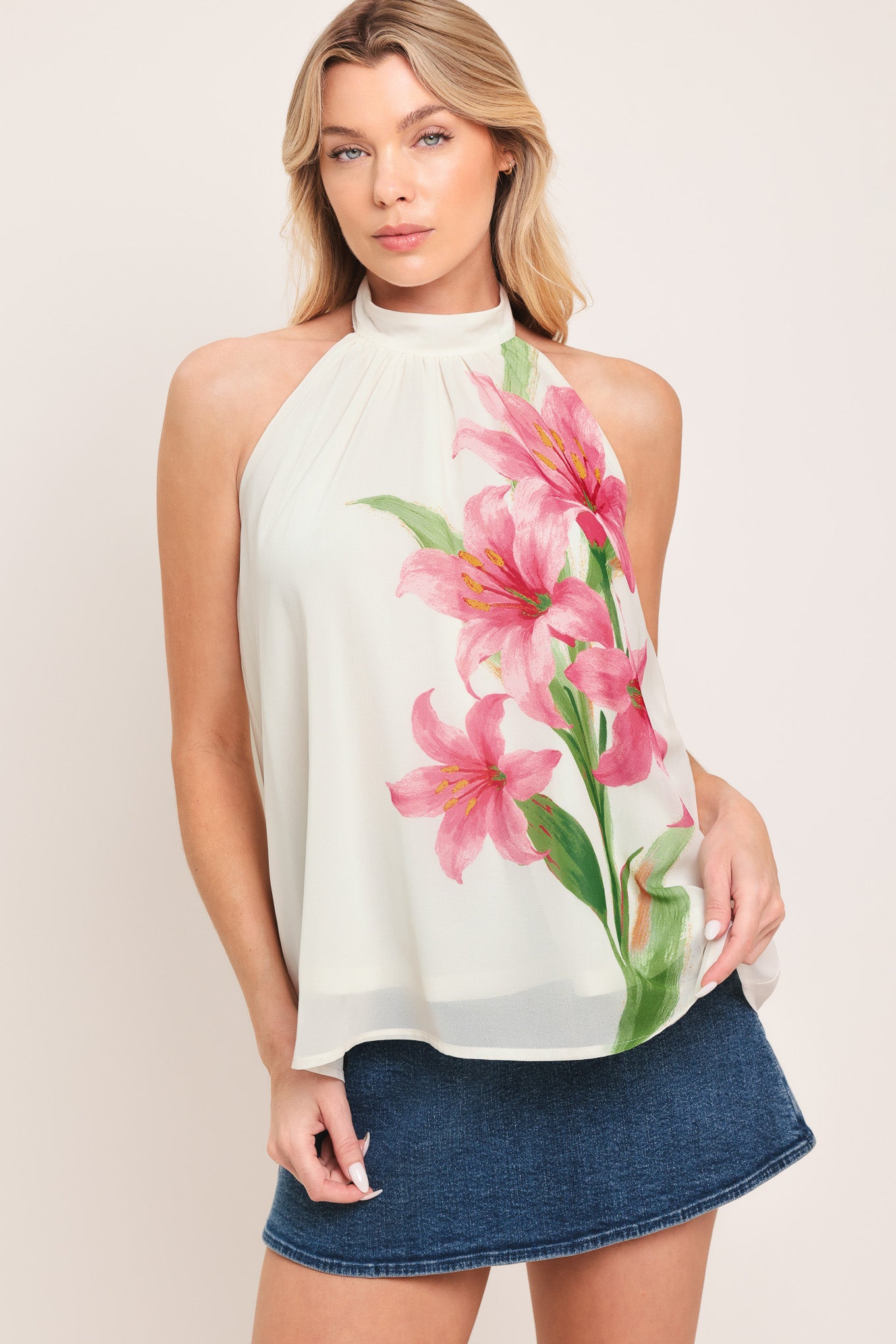 Woman wearing a floral halter top | Flying Tomato