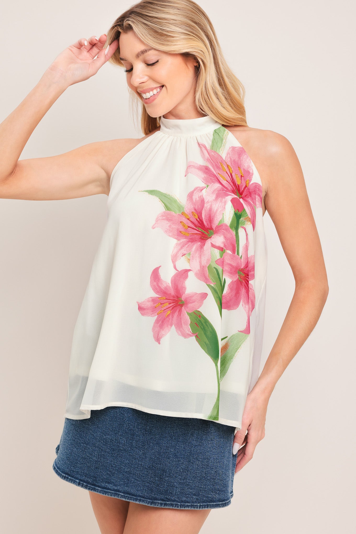 Woman wearing a floral halter top | Flying Tomato