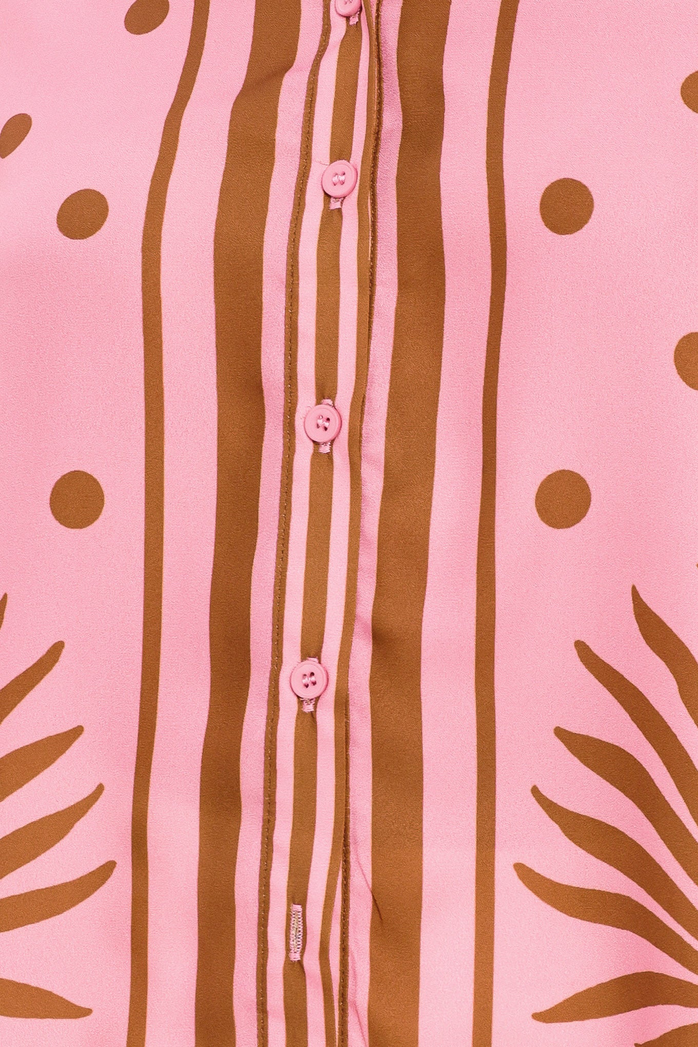 Close up of a pink button up top with brown polka dots and printed palms | Flying Tomato