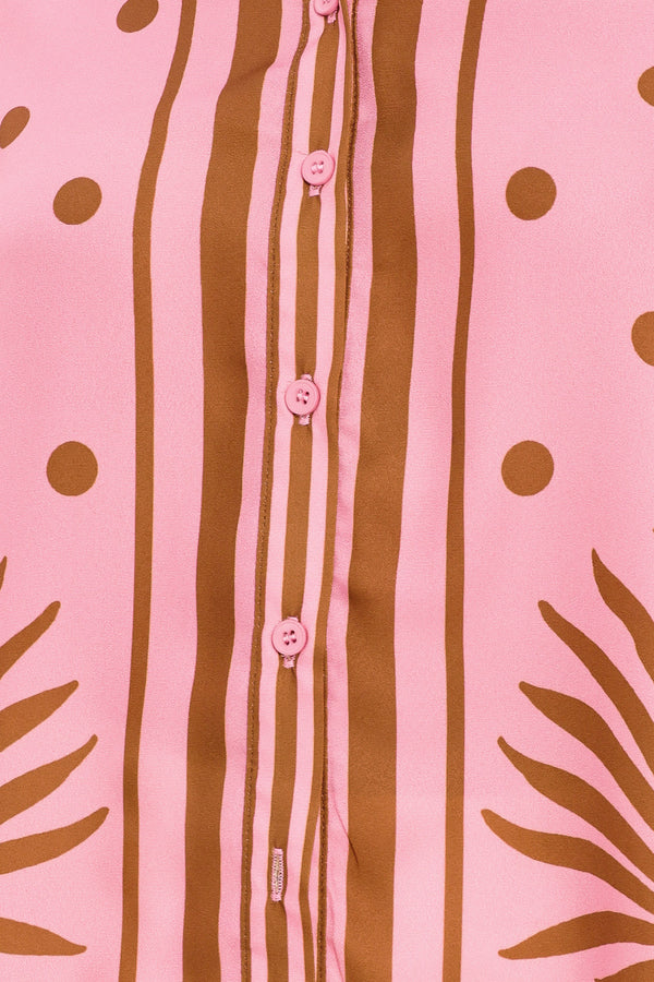 Close up of a pink button up top with brown polka dots and printed palms | Flying Tomato