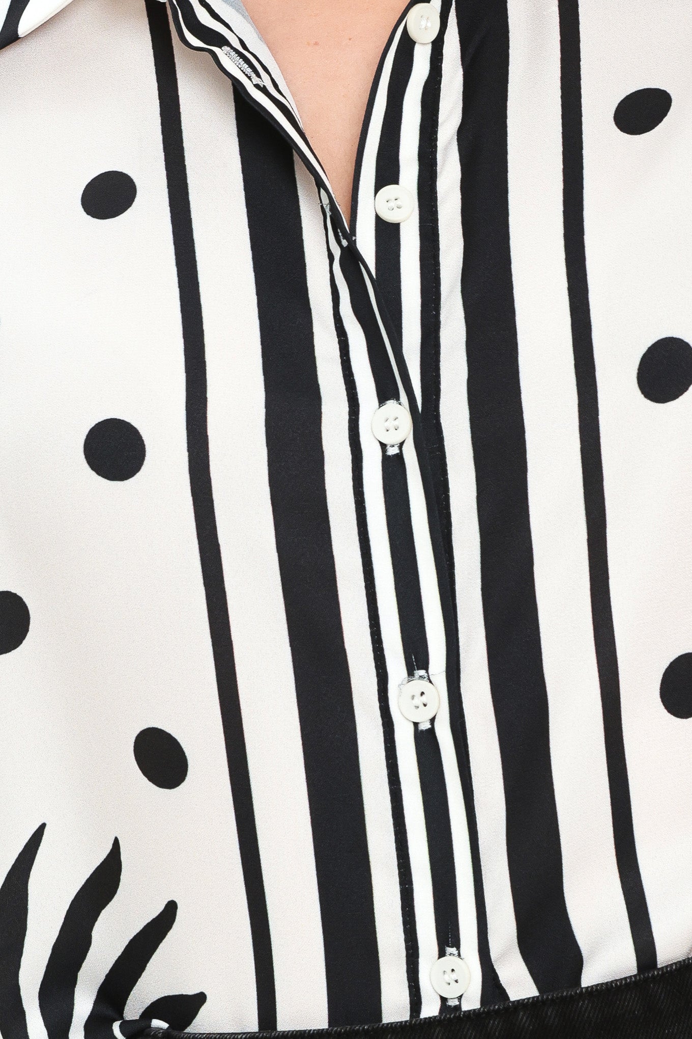 Close up of a white button up top with black polka dots and printed palms | Flying Tomato