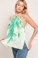 Woman wearing a halter top with green leaf pattern | Flying Tomato