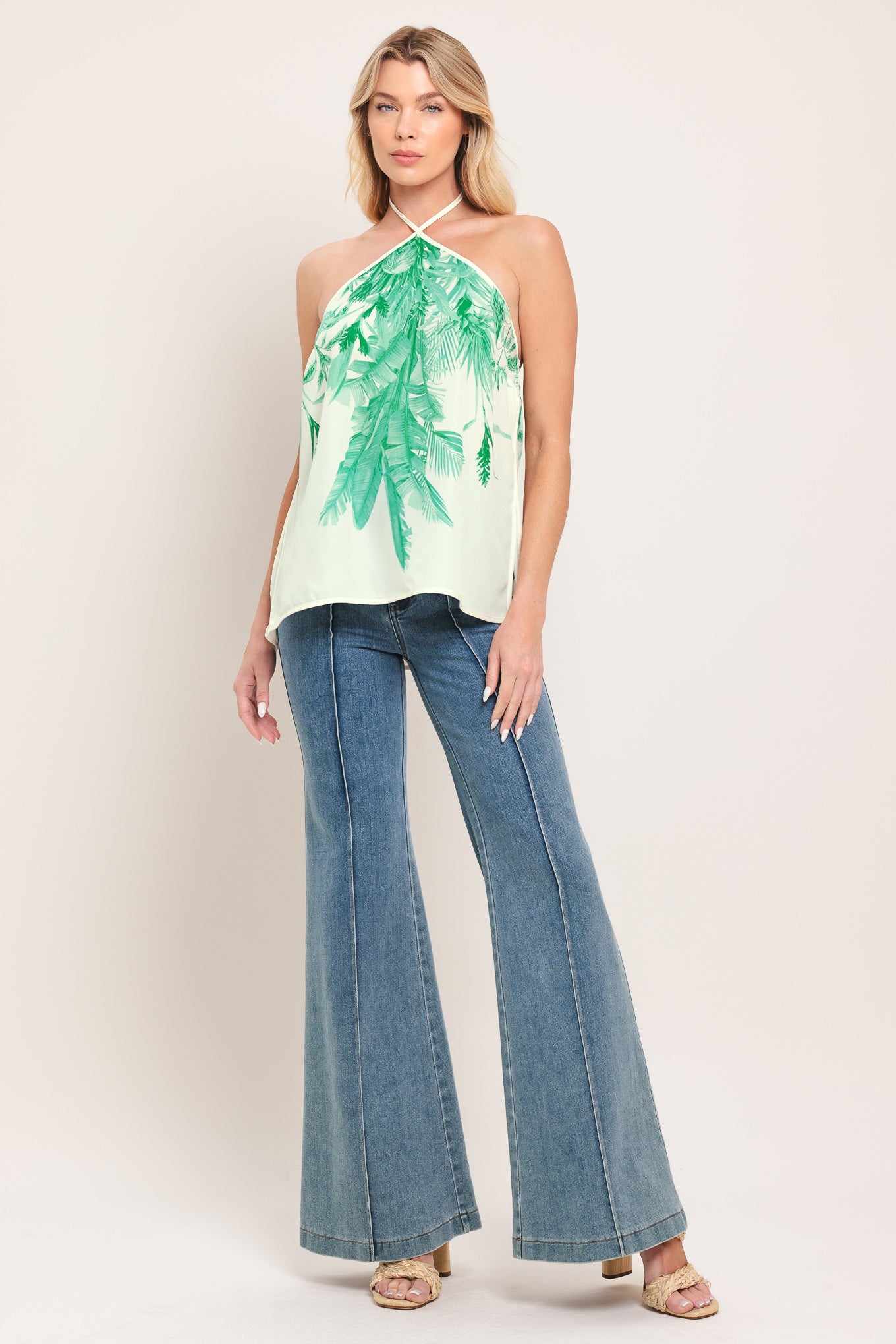 Woman wearing a halter top with green leaf pattern | Flying Tomato