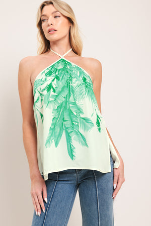 Woman wearing a halter top with green leaf pattern | Flying Tomato