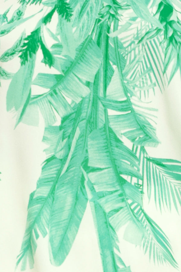 Tropical leaf pattern in green on a white fabric | Flying Tomato
