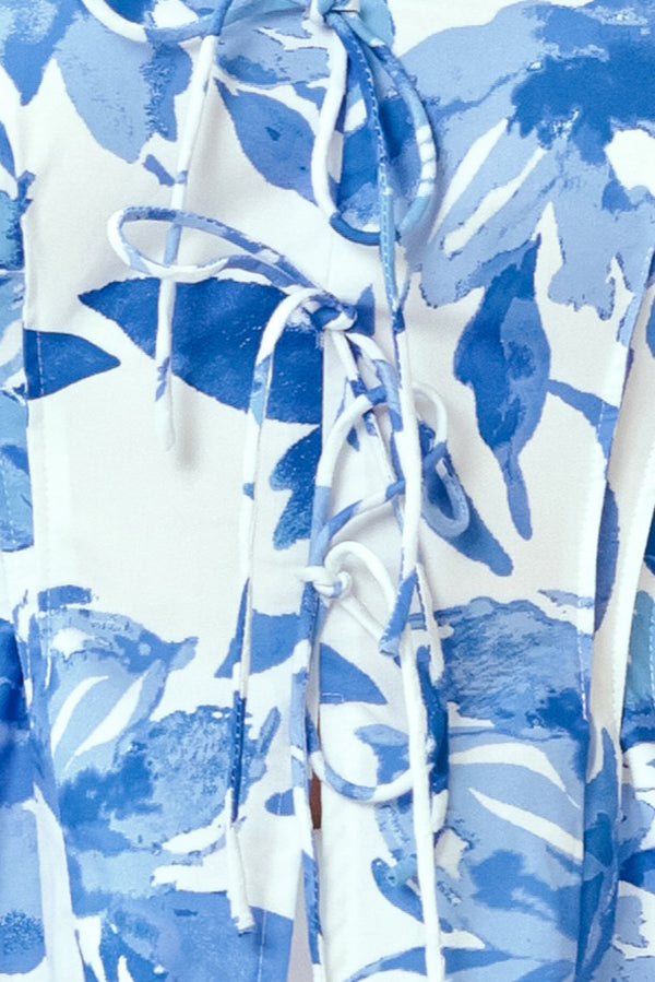 Blue and white floral patterned fabric with a tie | Flying Tomato