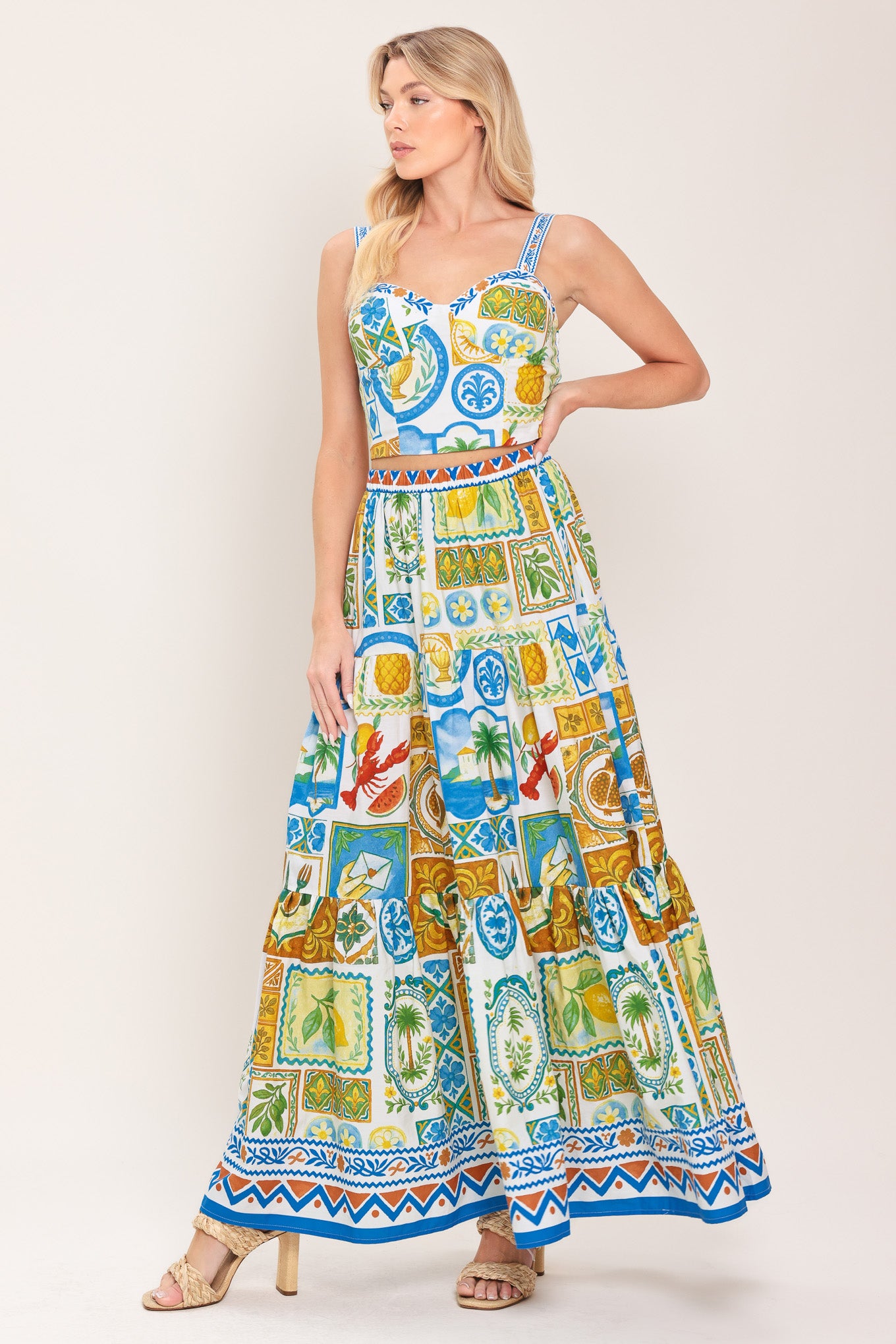 Woman wearing a printed bustier crop top with straps and smocked back bodice | Flying Tomato